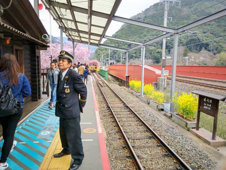 SAGONO RAILWAY, KYOTO, JAPAN - April 6, 2017 : Sagano Scenic Railway (Romantic Train) is Best Sightseeing Train Line Runs Along the Hozugawa River between Kameoka.のeditorial素材