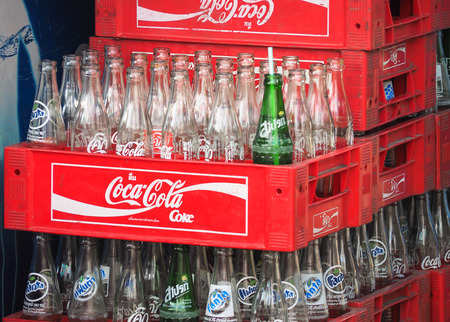 BANGKOK - MAY 24: Empty bottles of Coca Cola for recycle on May 24, 2016 in Bangkok, Thailand. Coca Cola drinks are produced and manufactured by The Coca-Cola Companyのeditorial素材