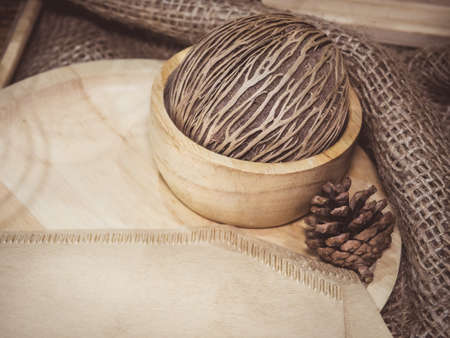 Pine cone decoration on wooden background for advertising and for all opportunitiesの写真素材