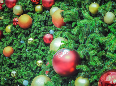 Decoration bauble on decorated Christmas tree, Christmas celebration holiday backgroundの写真素材