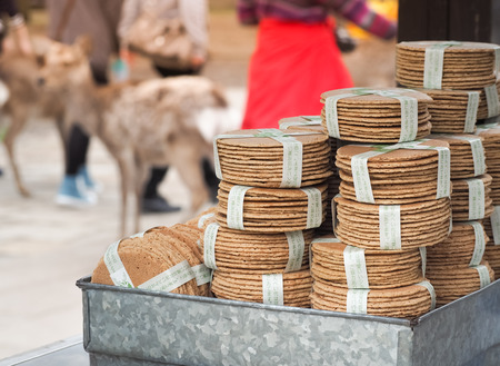 Nara, Japan - April 8, 2017: Japanese crackers Senbei sold for feeding deer in nara park. Senbei...