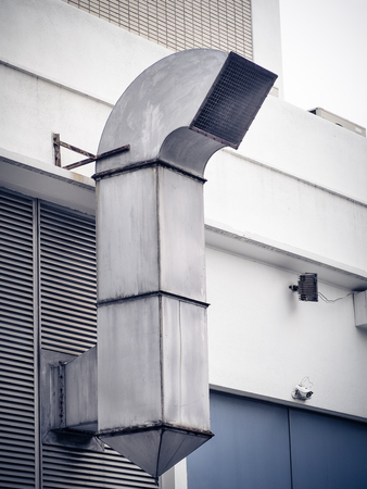 Smokestack for smoke out from kitchen. Chimney on wallの写真素材