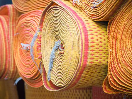Color of thai traditional fabric roll mats texture and background.
