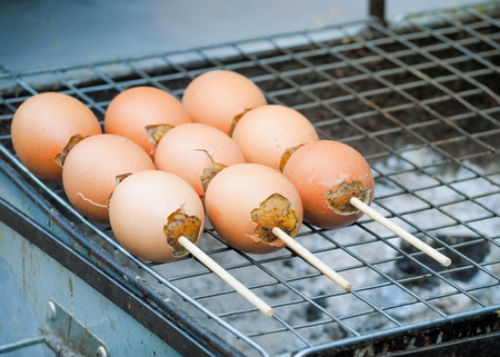 Grilled eggs sold on street market, Bangkok, Thailand , Thai traditional recipeの写真素材
