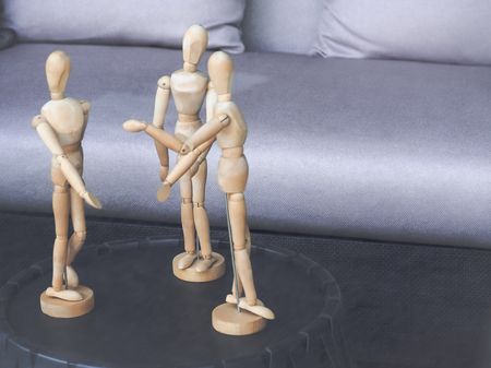 Three Wooden Dummy Model in Meeting action. Concept for teamwork in business. With space for place your text.の写真素材