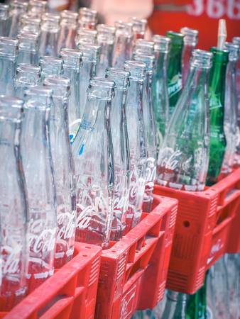 BANGKOK, THAILAND - FEBRUARY 26: Empty recycle bottles of Coca Cola in red plastic box on February 2, 2018 in Bangkok, Thailand. Coca Cola drinks are produced and manufactured by The Coca-Cola Companyのeditorial素材