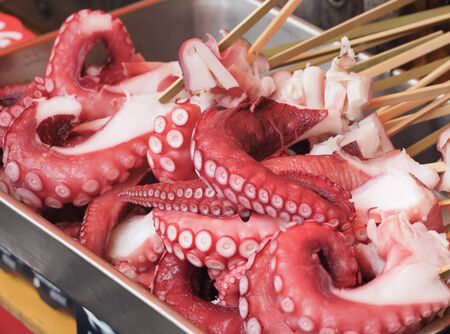Fresh octopus with skewers for Grilled, Sale in seafood marketの写真素材
