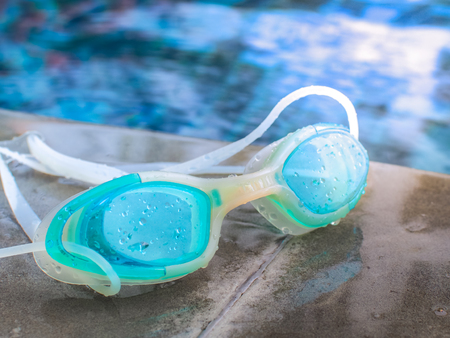Blue modern Swim goggles on the swimming poolの写真素材