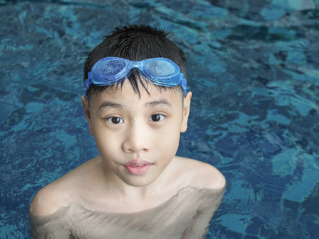 Asia boy at swimming pool. Outdoorの写真素材