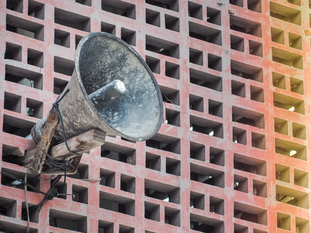 Retro speakers on the wall of building. With space for place your text.の写真素材