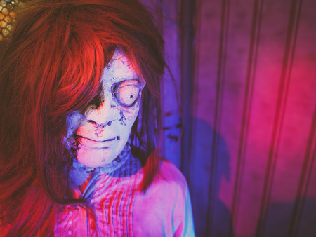 Scary ghost plastic mannequin in the dark room. Idea image for Halloween night.の写真素材