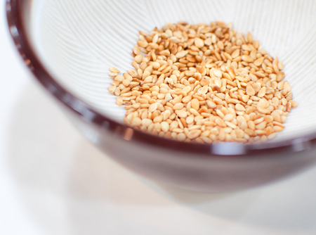 Selective focus on the roasted sesame seeds in Japanese blow. With space for place your text.の写真素材