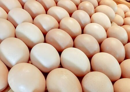Fresh chicken or duck eggs are sold in the farm market. Agriculture food image.