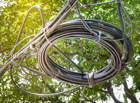 Wire and cable clutter, The chaos of cables and wires over head on the street, Bangkok, Thailand.の写真素材