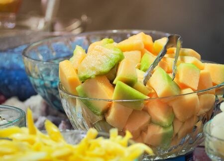 Sweet cantaloupe or melon with syrup in glass bowl. Thai dessert  (ruam mit) .の写真素材