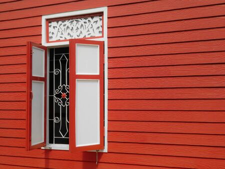 Red and white wood window exterior of Thai home style. Thai traditional culture.