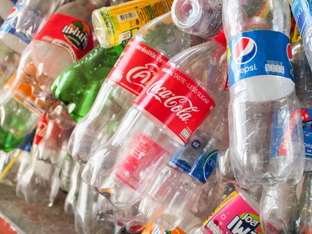 BANGKOK, THAILAND- October 19, 2019 : Pile of soft drink empty plastic bottles collected to ready...