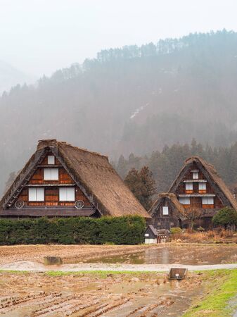 Shirakawa-go, Japan - March 11, 2019: Traditional gassho-zukuri house in shirakawa-go on a rainy day. Shirakawa-go is one of Japan`s World Heritage Sites located in Gifu Prefecture, Japan.のeditorial素材