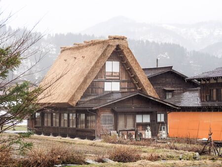 Shirakawa-go, Japan - March 11, 2019: Traditional gassho-zukuri house in shirakawa-go on a rainy day. Shirakawa-go is one of Japan`s World Heritage Sites located in Gifu Prefecture, Japan.のeditorial素材