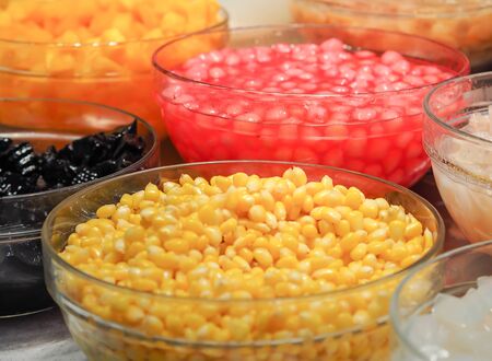 Sweet tropical corn with syrup in glass bowl. Thai dessert (ruam mit)の写真素材