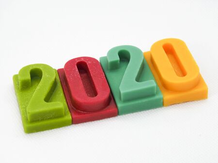 2020 Happy new year and Christmas background, bar of chocolate number on white background.