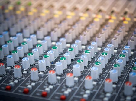 Sound equalizer mixing. Professional studio equipment for sound mixing. Music studio image. Close up...