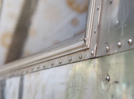 Aluminum wall or rustic metal sheet background. Selective focus of architecture detail background.