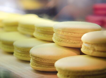 Selective Focus of French Lemon Macaroons, Sweet Yellow Almond Macarons or French sweet cookie.