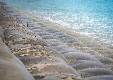 Sand bags or sandbagger installed for protect the collapse of the beach, The concept for the conservation of Nature.の写真素材
