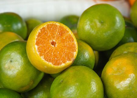 Bunch of fresh green oranges. Healthy fruits.の写真素材