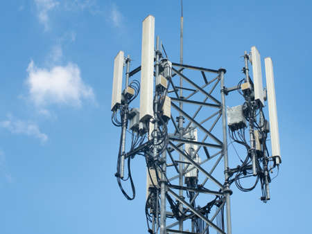 LTE, GSM, 2G, 3G, 4G, 5G tower of cellular communication. Telecommunication tower against the blue...