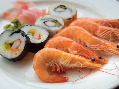Delicious Boiled Shrimps with Maki Rolls Served on Plate, Fresh Shrimps Cooked in Japanese restaurant.の写真素材