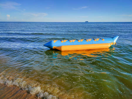 Banana boat moored in front of the beach in the summer for the holidays.の写真素材