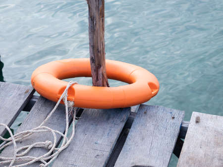 Plastic lifebuoys are installed at the piers to prevent tourists from falling into the river or sea.の写真素材