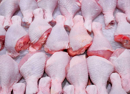 Fresh chicken drumsticks are available on shelves in supermarkets.の写真素材