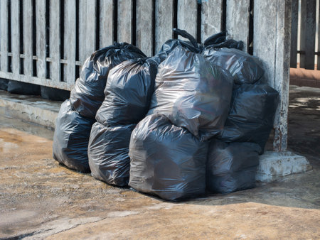 Garbage is packed in black plastic bags.の写真素材