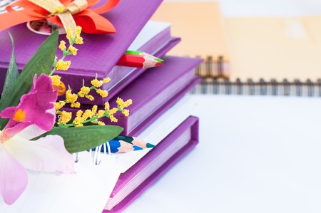 Notebook with pencil and flower orchidの写真素材