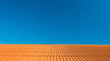 Orange roof with blue skyの写真素材