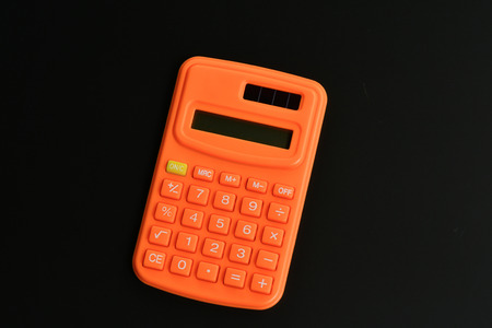 Calculator on black backgroundの写真素材