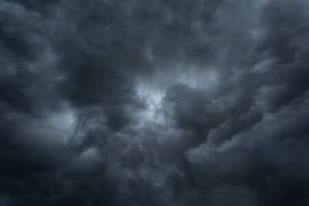 Dark storm cloud befor rainy, Black and high contrast cloud backgroundの写真素材