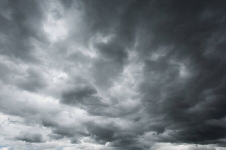 Dark storm cloud befor rainy, Black and high contrast cloud backgroundの写真素材