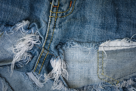 Torn or worn old jean background