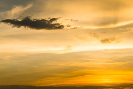 Beautiful orange sky with sunlight and sunsetの写真素材