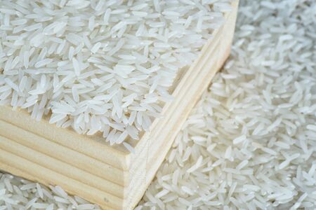 Closeup jasmine rice in wooden boxの写真素材