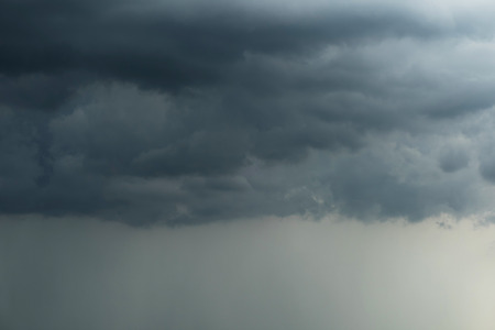 Dark sky and black clouds with rainy, Dramatic black cloud and thunderstormの写真素材