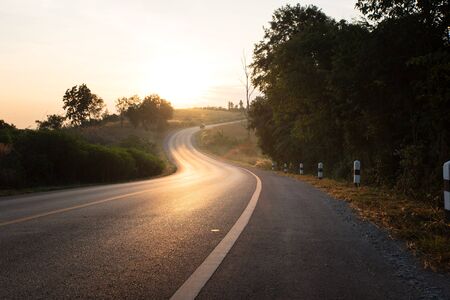 Hill and country road in morningの写真素材