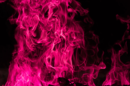 Blaze pink fire background and textured, Pink igniting background on blackの写真素材