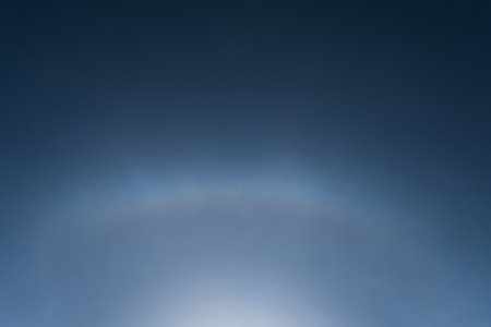 Sun halo effect on blue skyの写真素材