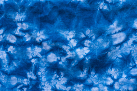 Pattern of blue dye on cotton cloth, Dyed indigo fabric background and texturedの写真素材