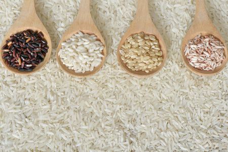 Topview various rice  on wooden scooopの写真素材
